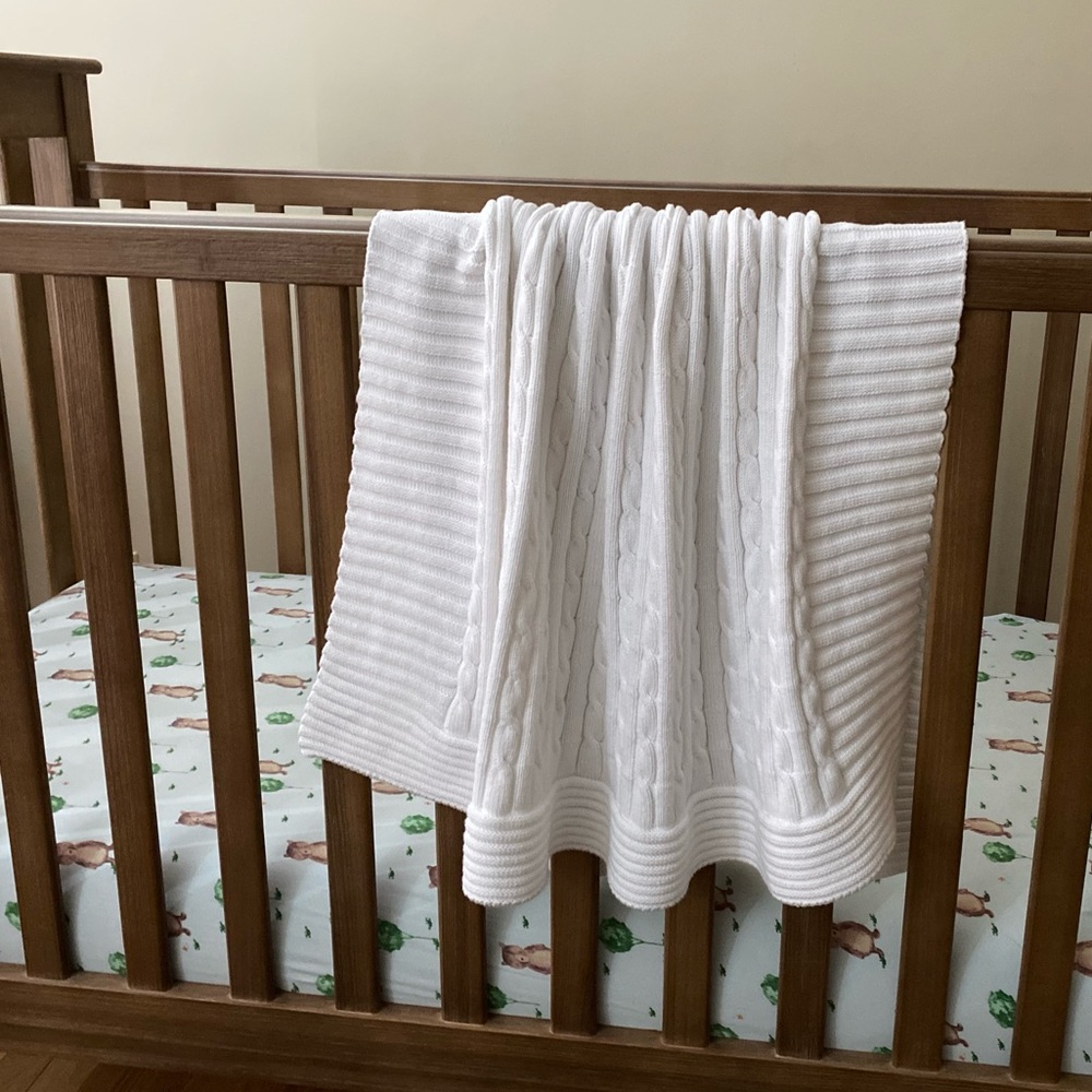 Elegant baby white knit baby blanket heirloom quality.